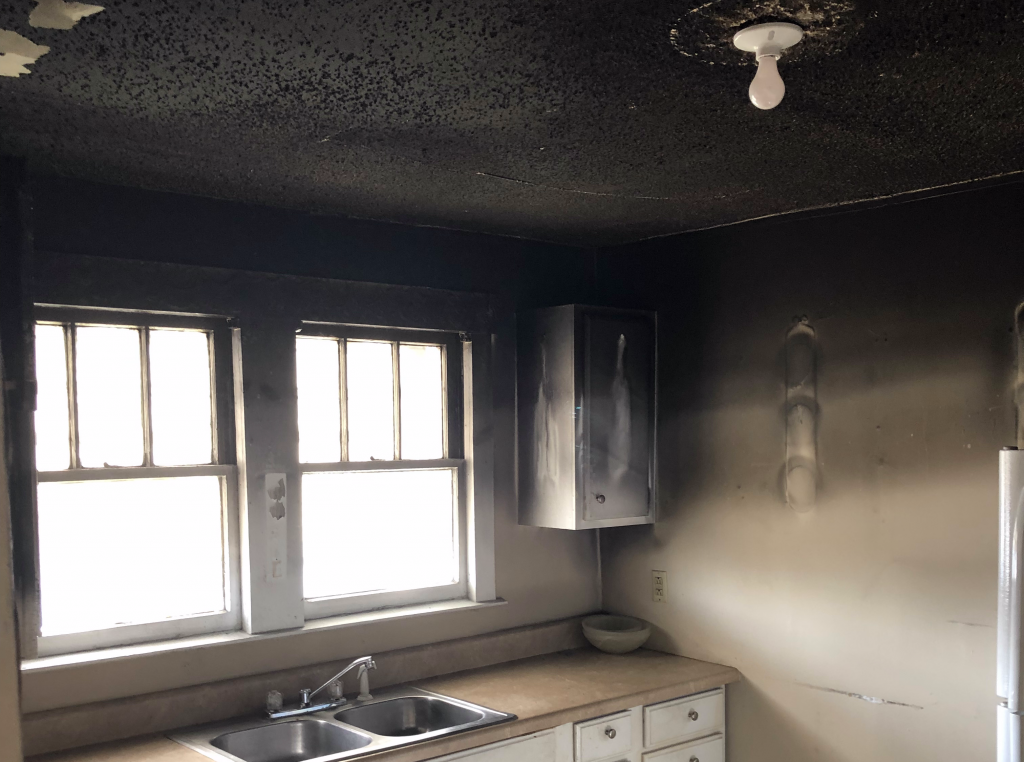 Heavy smoke and soot damage in a Austin kitchen after a fire