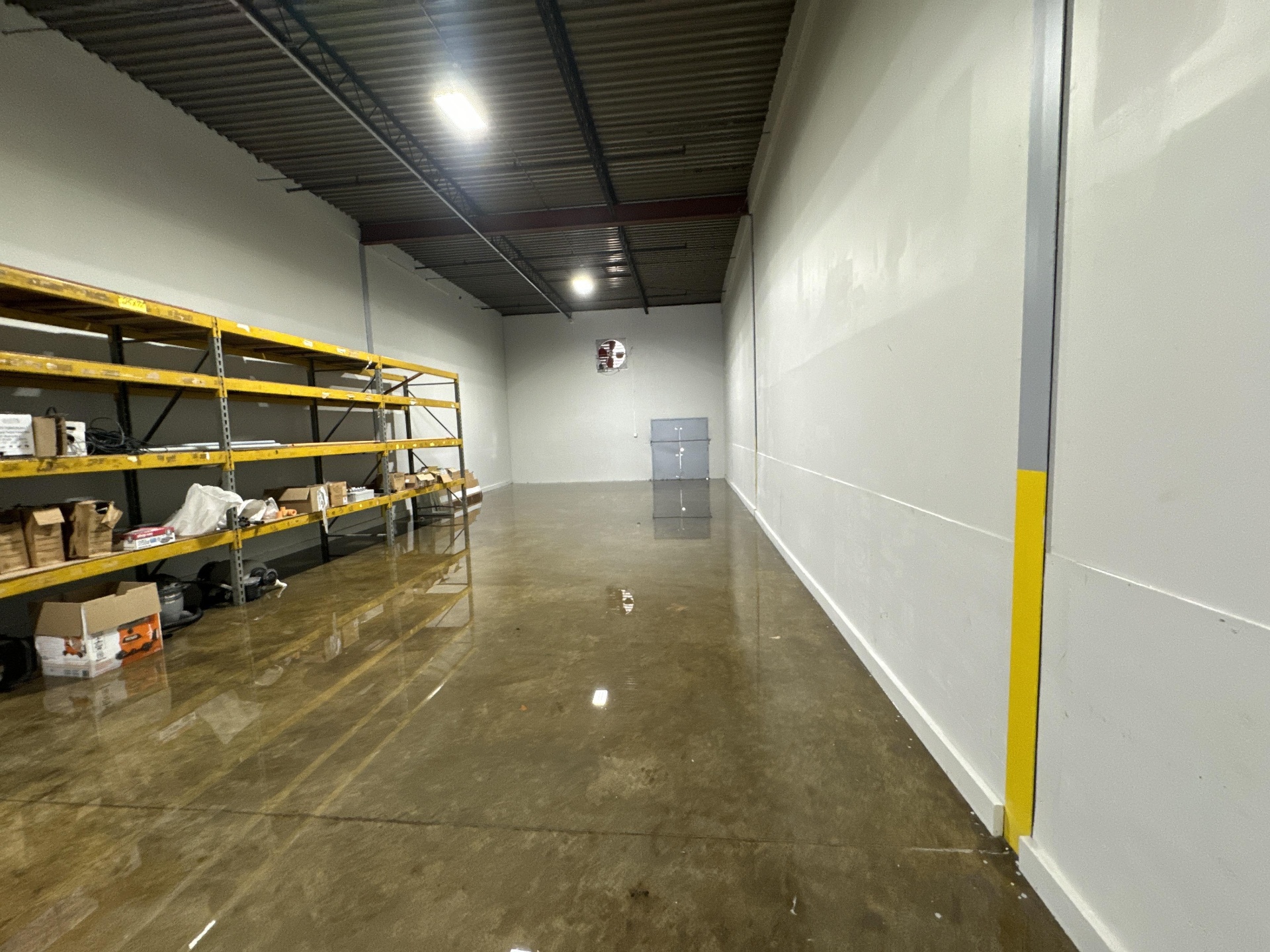 Warehouse shelves flooded after a storm event in Austin